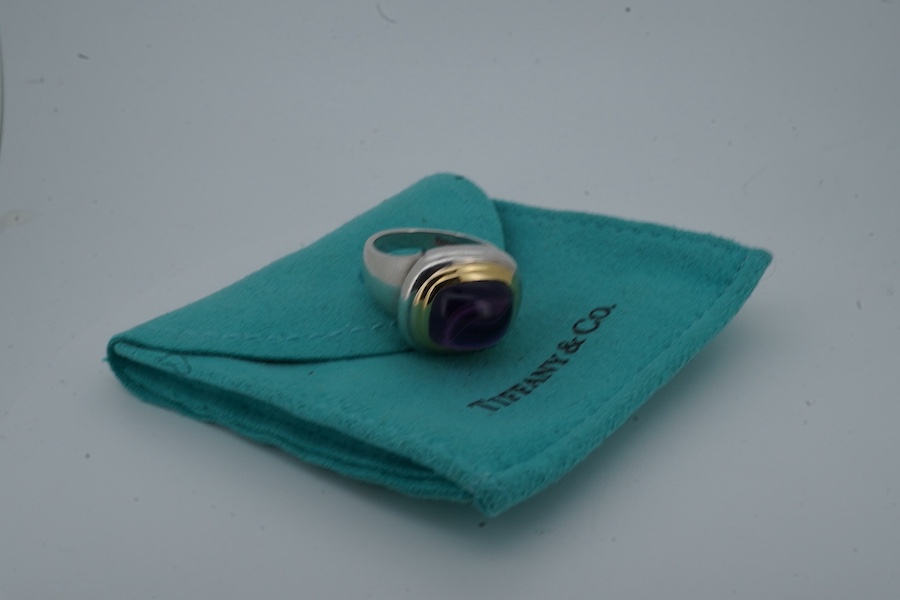 Paloma Picasso for Tiffany & Co., an amethyst ring, set with a sugarloaf cabochon amethyst, collet-set in bicoloured silver, size L, signed Tiffany & Co. and Paloma Picasso, British hallmarks for silver, pouch stamped Ti
